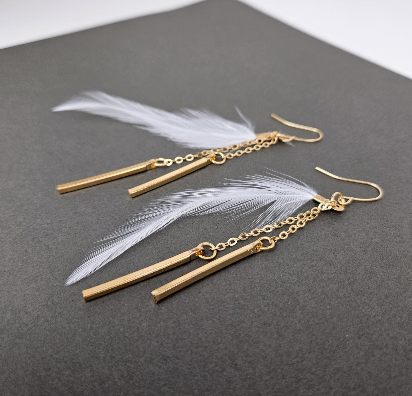Gold Bar White Feather Dangle Earrings
