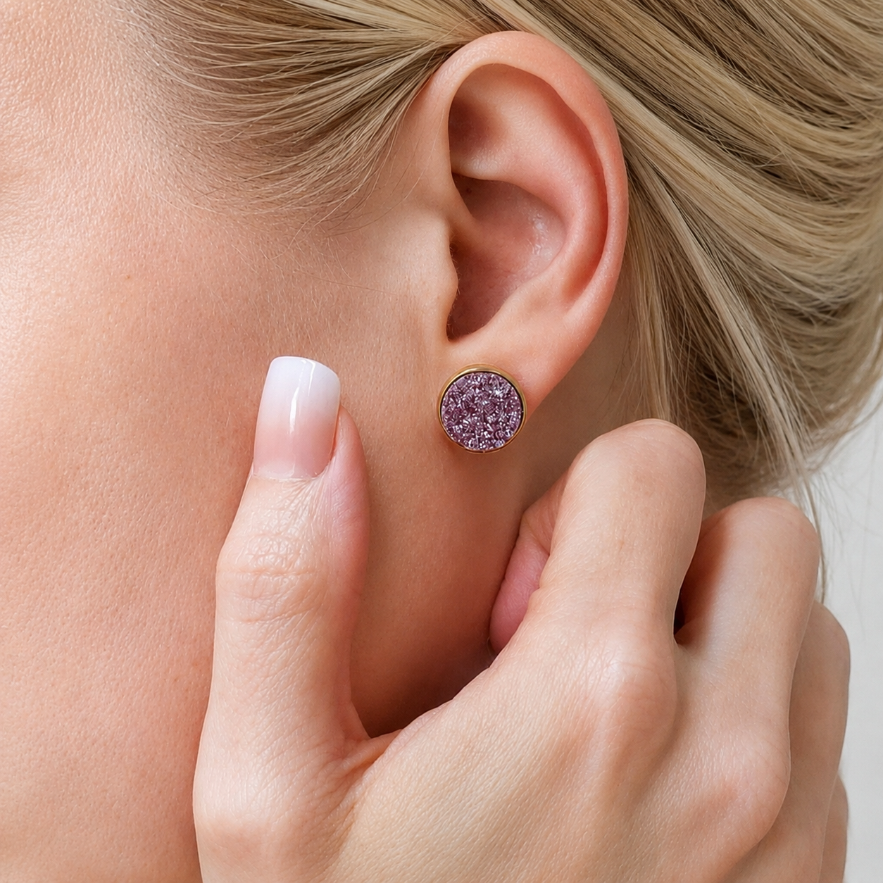 Round lavender glitter druzy stud earrings featured on a blonde lifestyle model, showcasing sparkly gold bridal party fashion jewelry.