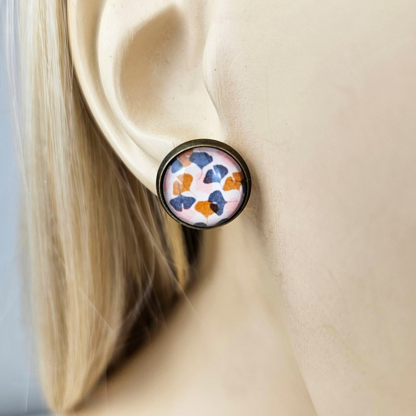 monstera and ginkgo leaf bronze stud glass earrings modeled